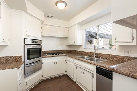 Kitchen with Stainless Steel Appliances and White Cabinets